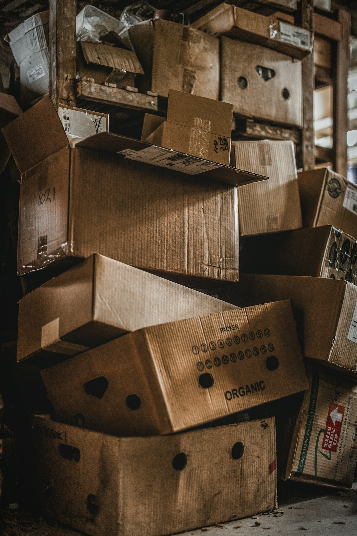 Pile of cardboard boxes stacked in a storage area
