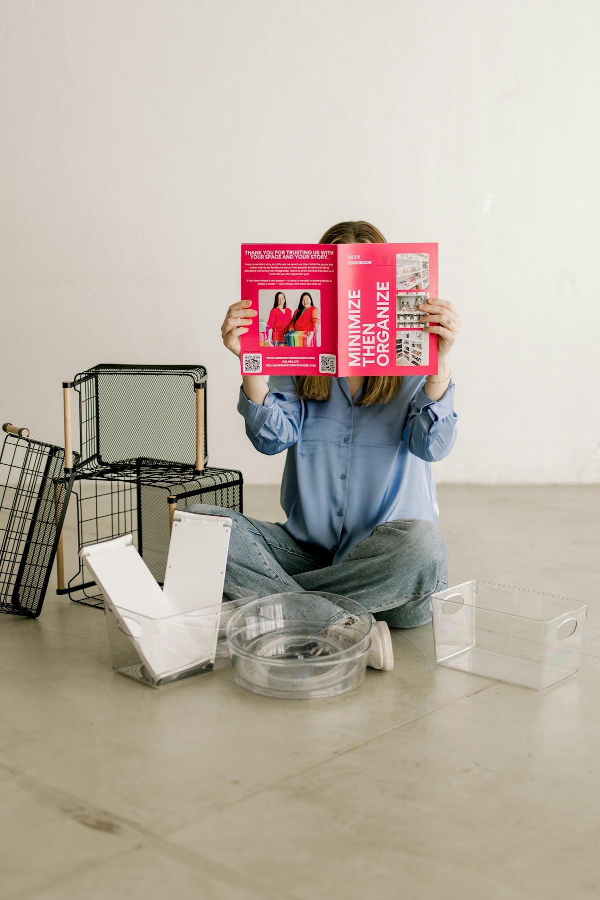 Person holding minimize then organize booklet with storage items